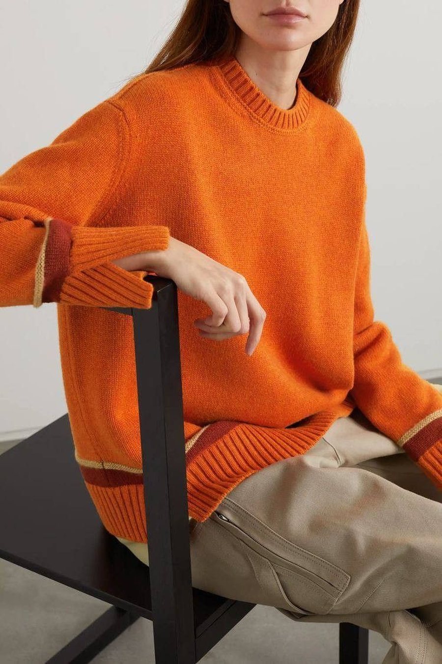 Orange crewneck cashmere sweater with striped cuff detail